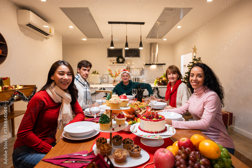 Portrait of big family celebrating Christmas party together in house. 