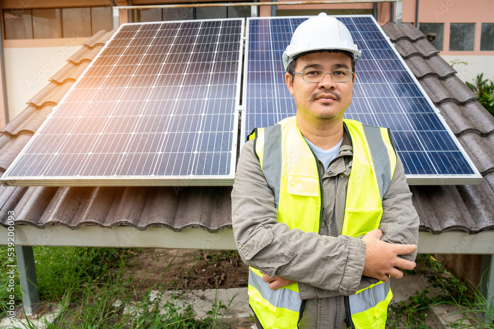 Blue Solar Photo voltaic panels system of apartment building on sunny day. Renewable ecological gree