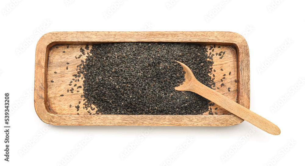 Wooden board with black sesame seeds isolated on white background