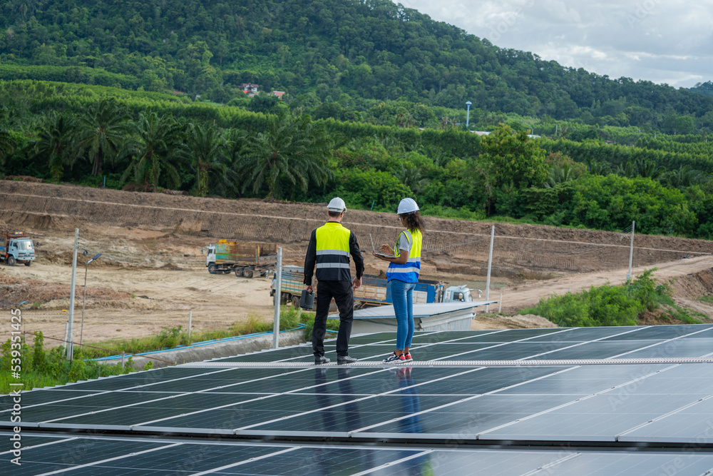 Technician inspection and repair solar cell on the roof of factory,Service check installation solar 