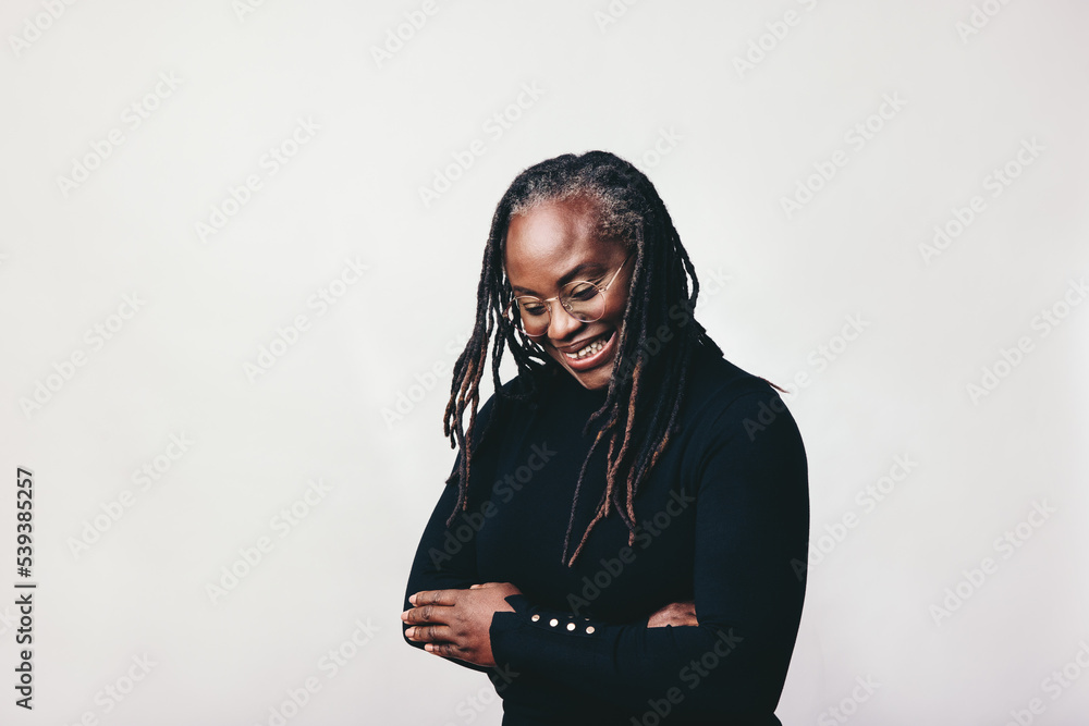 Happy middle aged woman smiling cheerfully in a studio