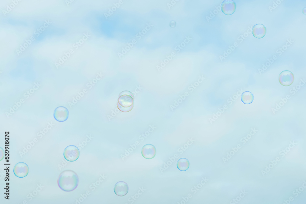 Beautiful soap bubbles on sky background