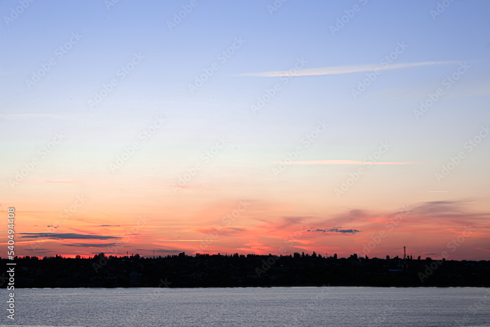 Beautiful view of river and sky with clouds in evening