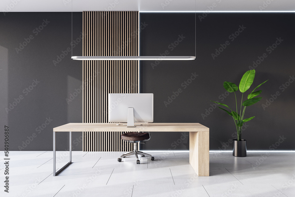 Front view on light wooden work table with modern computer on ceramic tiles floor with green plant i