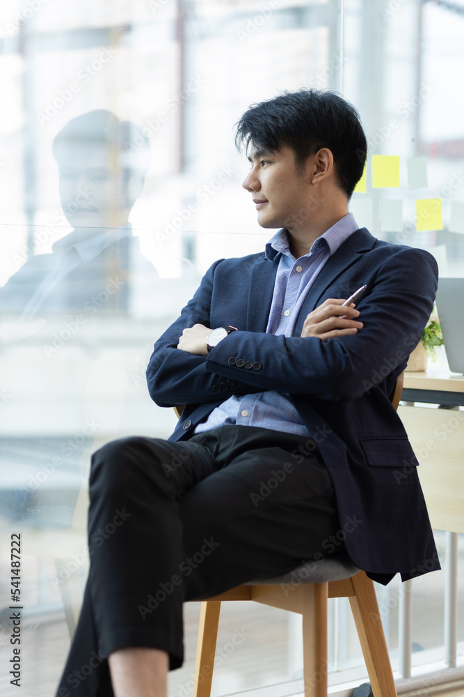 Portrait of a handsome businessman looking and thinking.