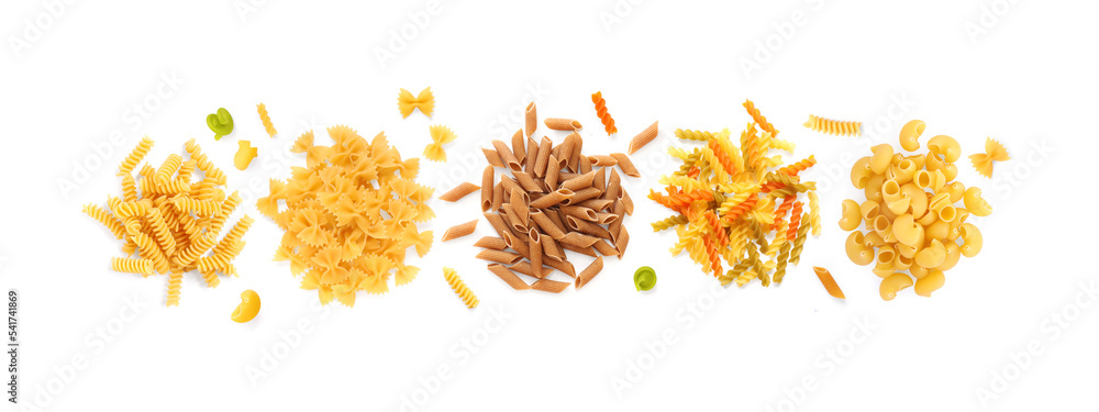 Creative layout made of different pasta on the white background. Flat lay. Food concept.  