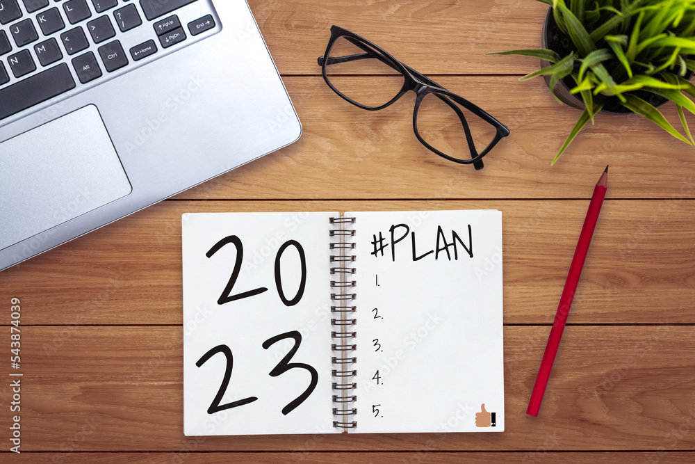 2023 Happy New Year Resolution Goal List and Plans Setting - Business office desk with notebook writ