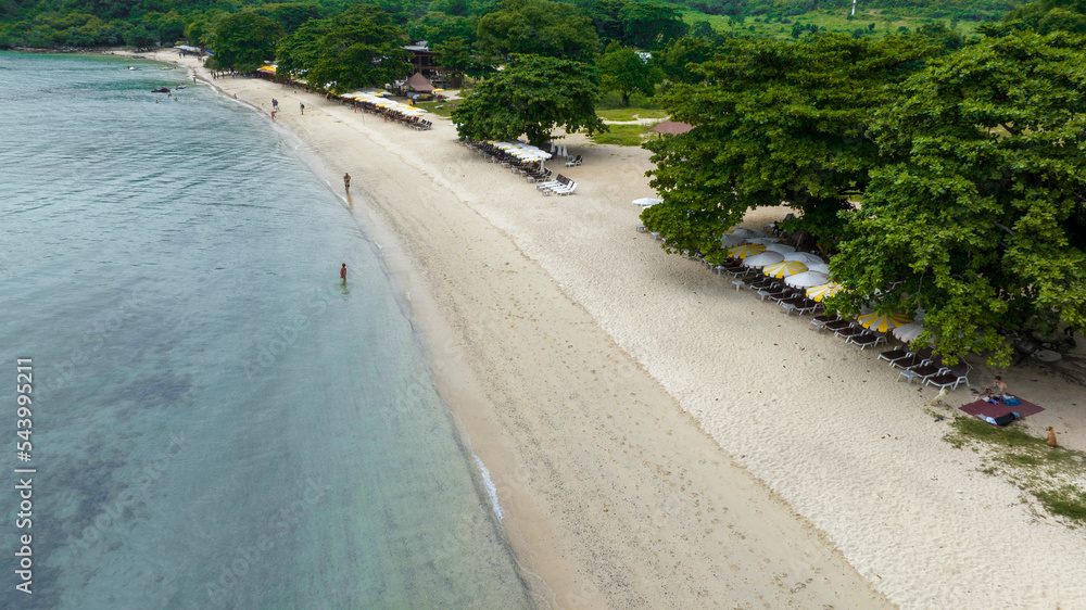 Natural Beach concept summer vacation. Nature of tropical summer beach. Umbrella board a boat and bo