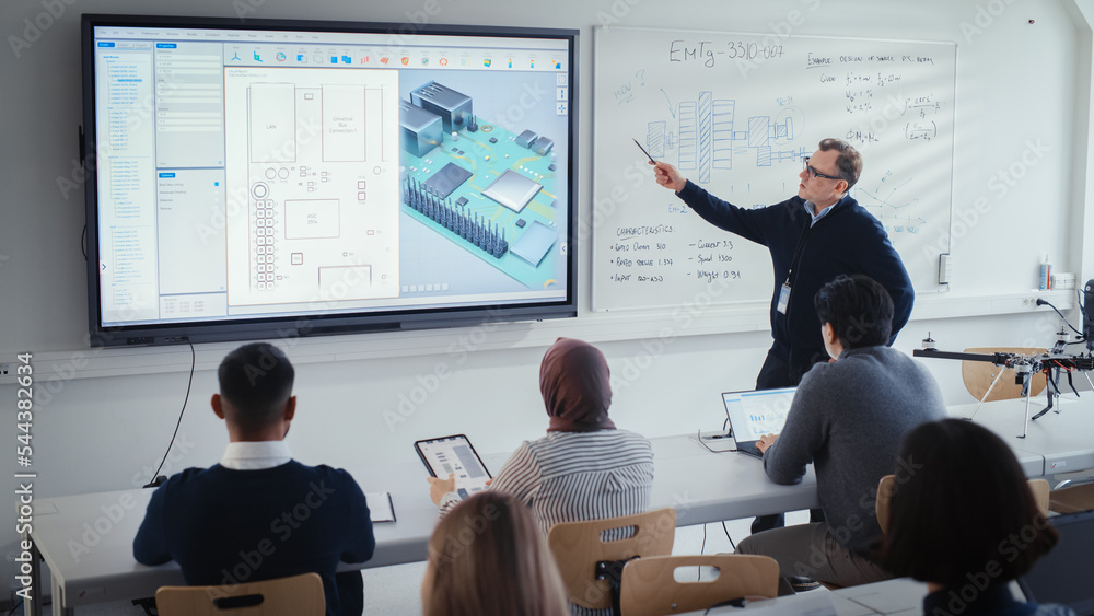 Male Teacher Explains About Computer Motherboard Components to Students During Lesson at University.