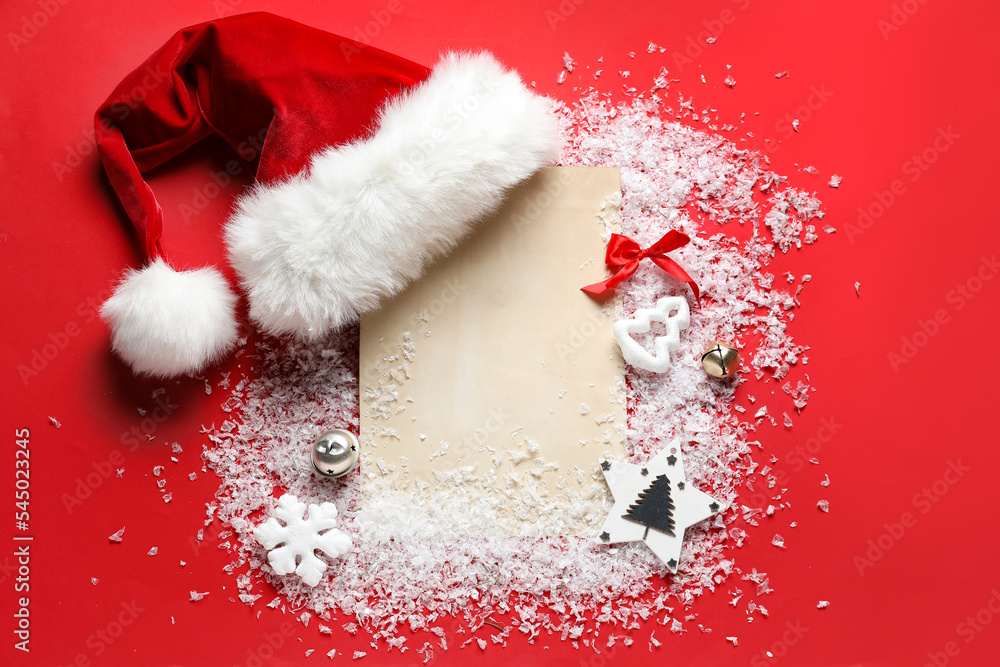 Composition with blank letter to Santa, hat, Christmas decorations and snow on red background