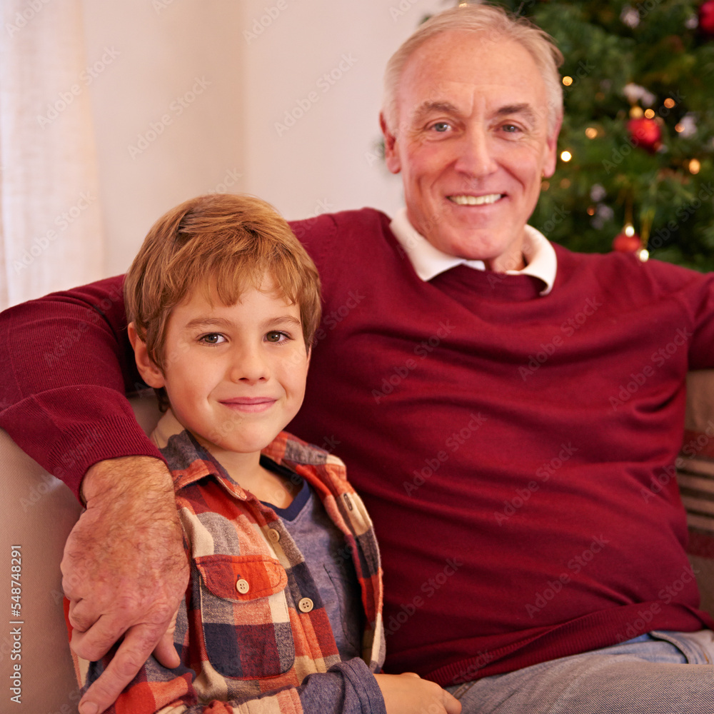 Elderly man, grandson and christmas portrait on sofa with love, bonding or happiness in family home.