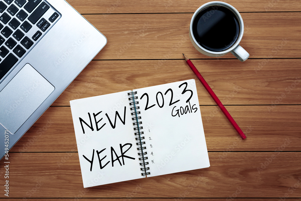 2023 Happy New Year Resolution Goal List and Plans Setting - Business office desk with notebook writ