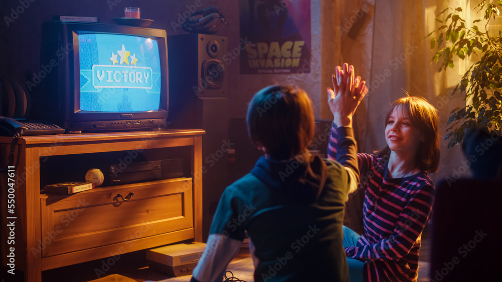 Nostalgic Childhood Concept: Young Boy and Girl Playing Old-School Arcade Video Game on a Retro TV S