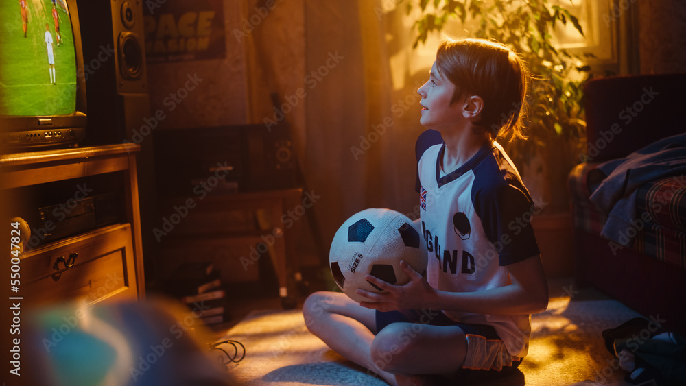 Young Excited Sports Fan Watches a Soccer Match on TV at Home. Boy Supporting His Favorite Football 