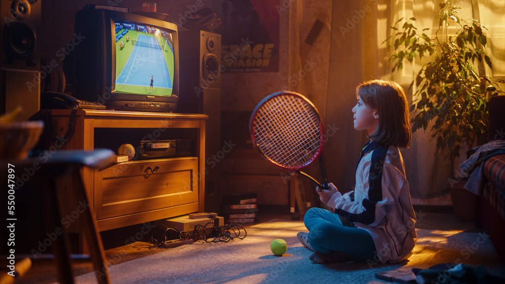 Young Sports Fan Watches a Tennis Match on TV at Home. Curious Girl Supporting Her Favorite Player, 