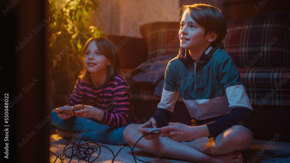 Nostalgic Childhood Concept: Young Brother and Sister Playing Arcade Video Game on a Retro Console i