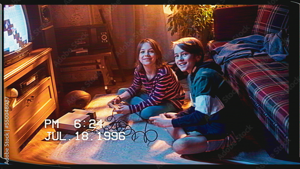 Retro VHS Tape Effect Home Video Concept: Young Brother and Sister Playing Old-School Arcade Video G