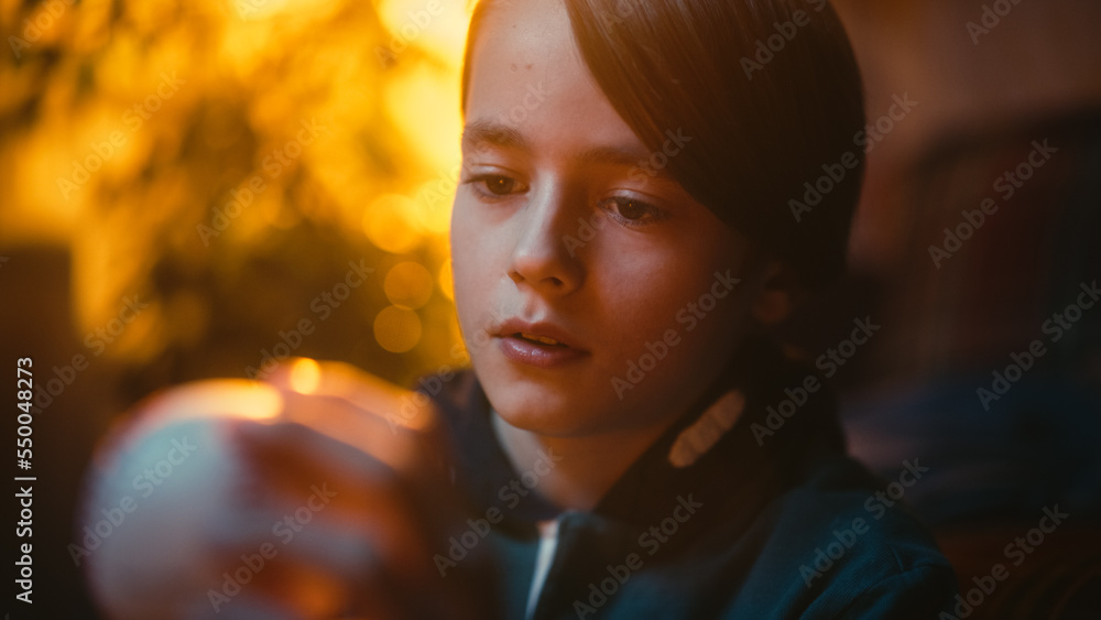 Close Up Portrait of a Young Sports Fan Holding White Baseball Ball at Home. Excited Boy Looking at 