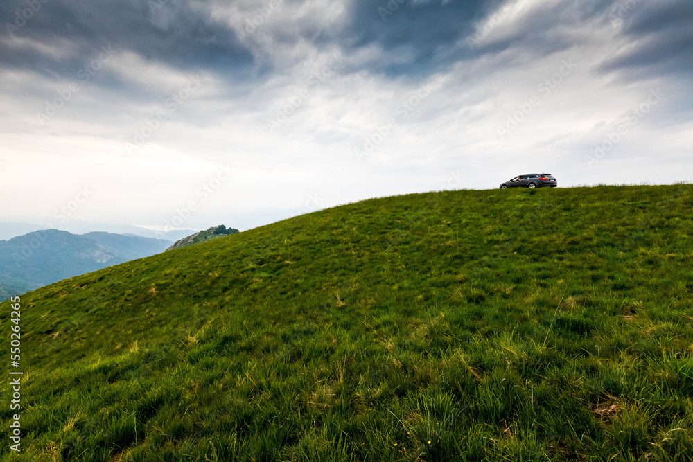 Green hills and valleys in the Alps mountains in Italy