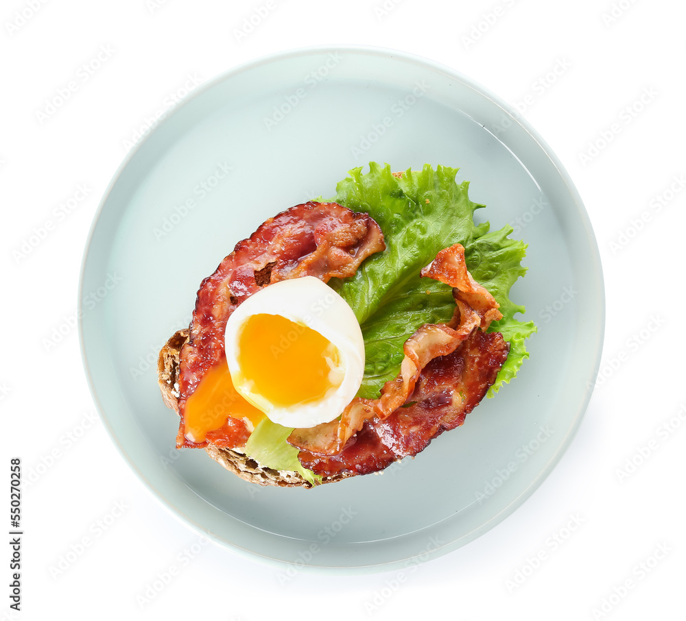 Plate of delicious toast with boiled egg and fried bacon on white background