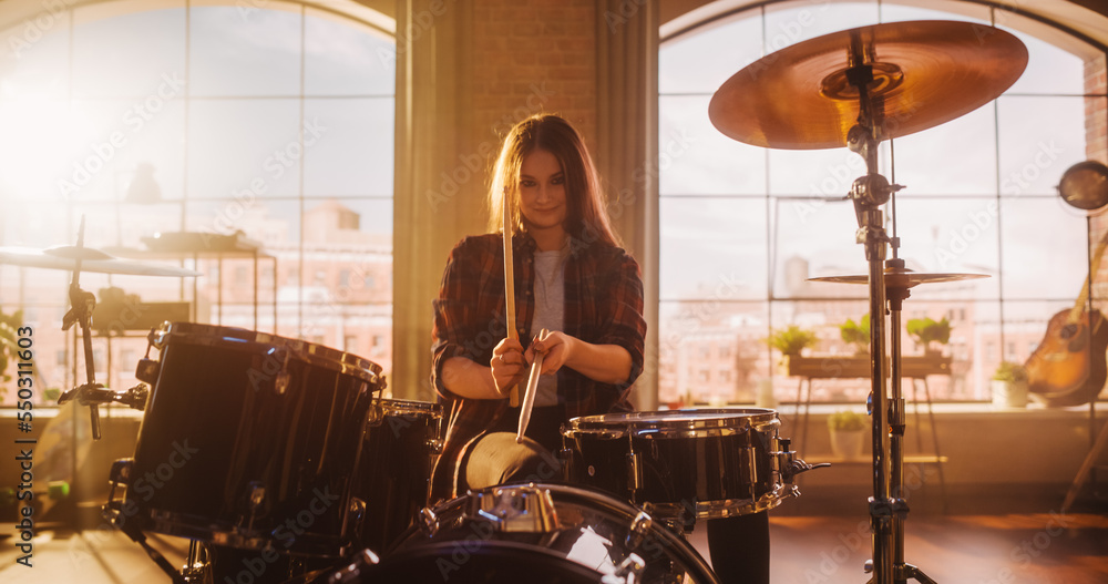 Expressive Drummer Girl Playing Drums in a Loft Music Rehearsal Studio Filled with Light. Rock Band 