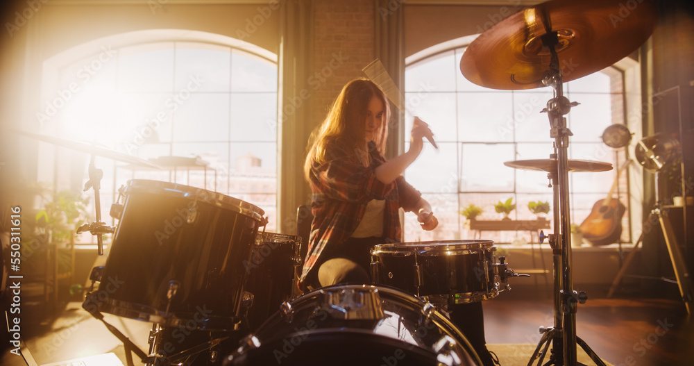 Beautiful Young Drummer Playing at a Band Rehearsal, Doing Tricks with Drumsticks. Learning Drum Sol