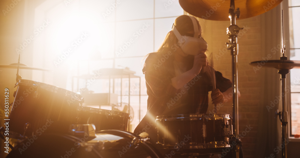 Portrait of a Drummer Girl Wearing a Virtual Reality Headset, Playing Drums in a Loft Living Room wi