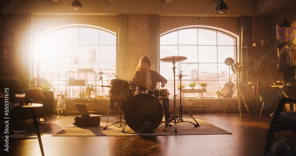 Expressive Drummer Girl Playing Drums in a Loft Music Rehearsal Studio Filled with Light. Rock Band 