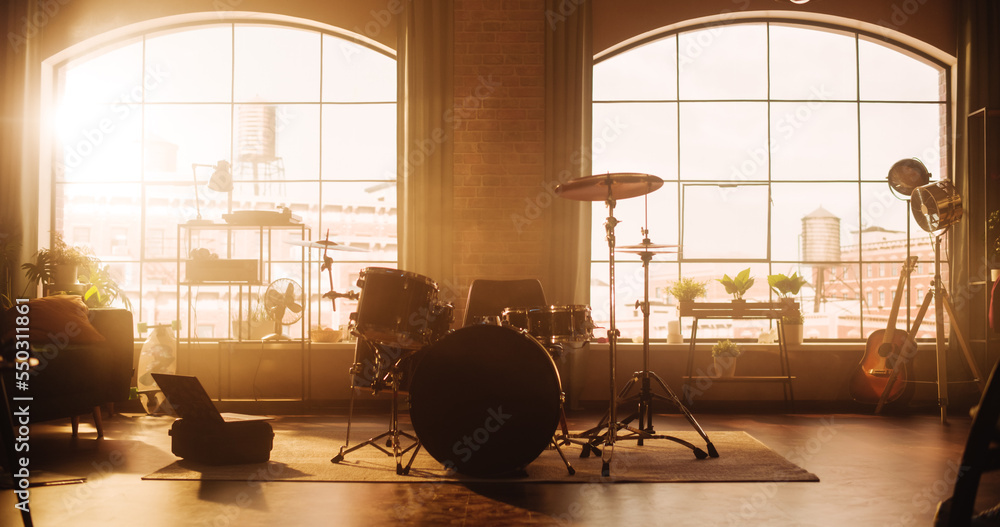 Establishing Shot: Music Rehearsal Studio in Loft Room with Drum Set in the Middle of It. Stylish In