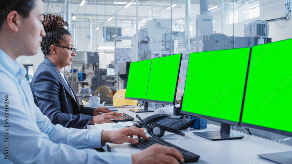 Factory Office Facility: Industrial Engineers Drafting Blueprints of a Heavy Industry Machine Parts 