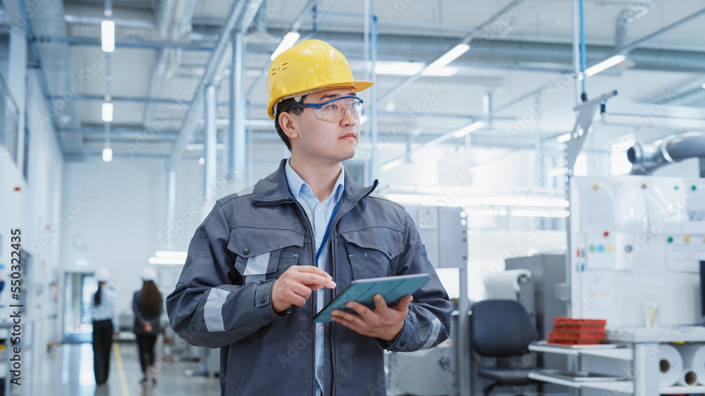 Portrait of a Young Asian Man, Working as an Engineer at a Industrial Facility, Wearing Work Jacket 