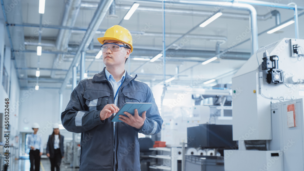 Portrait of a Young Asian Man, Working as an Engineer at a Factory Facility, Wearing Work Jacket, Sa