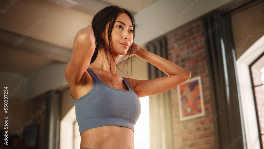 Close Up: Active Girl Watching Personal Trainer through Online Video Tutorial while Training at Home