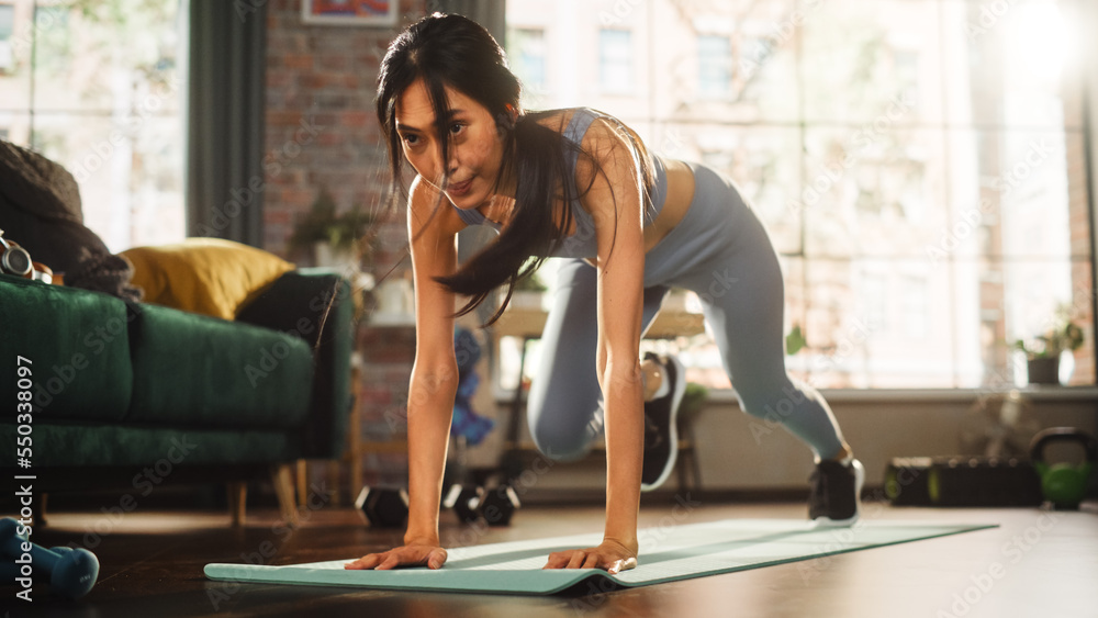 Portrait of a Beautiful Athletic Asian Woman Does ABS Crunches Exercises, Workout, Yoga, Stretching,