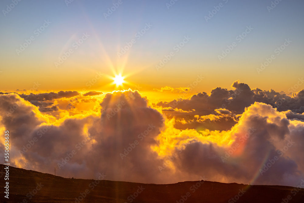 sunset over the clouds