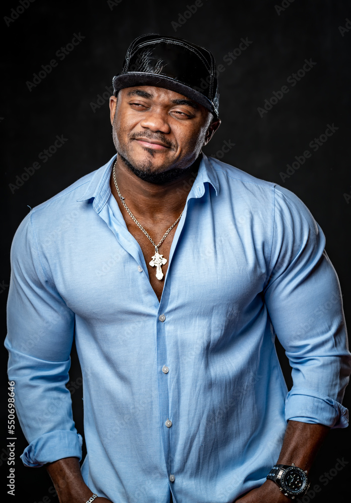 Strong american male in casual stylish cloth. Black handsome man in blue shirt.