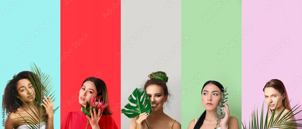 Group of beautiful young women with tropical leaves and flower on color background