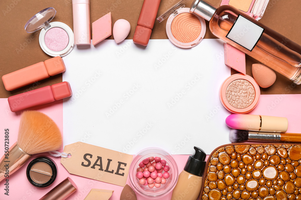 Blank paper sheet with bag, cosmetic products, accessories and sale tag on color background