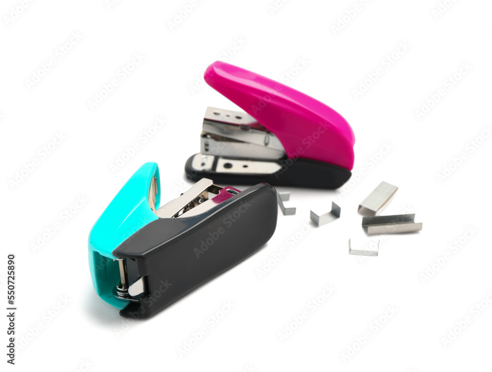 Office staplers with staples isolated on white background