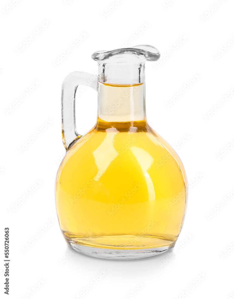 Glass decanter of apple cider vinegar on white background