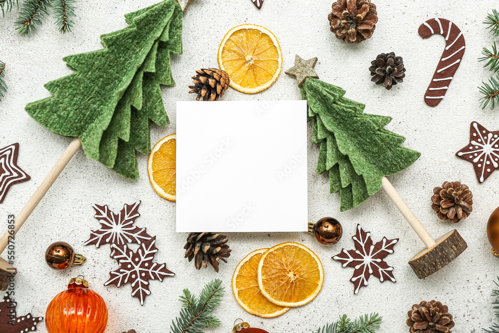 Blank card with Christmas decor and treats on white background