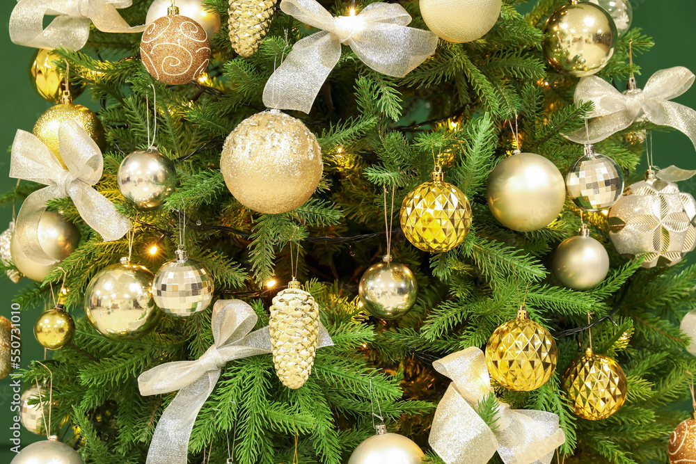 Decorated Christmas tree in room, closeup