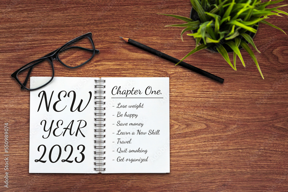 2023 Happy New Year Resolution Goal List and Plans Setting - Business office desk with notebook writ