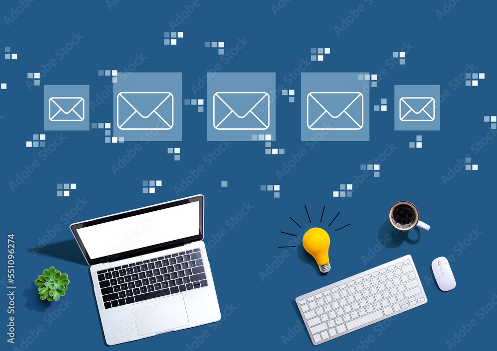 Email concept with computers with a light bulb from above