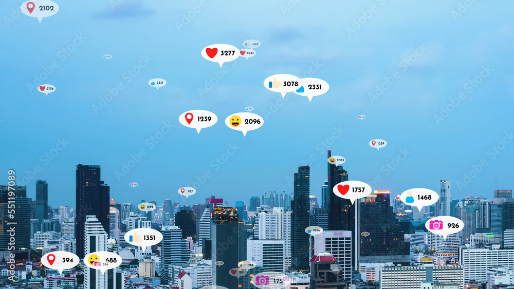 Social media icons fly over city downtown showing people reciprocity connection through social netwo