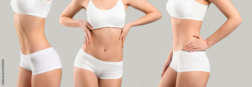 Young woman in underwear on grey background. Plastic surgery concept