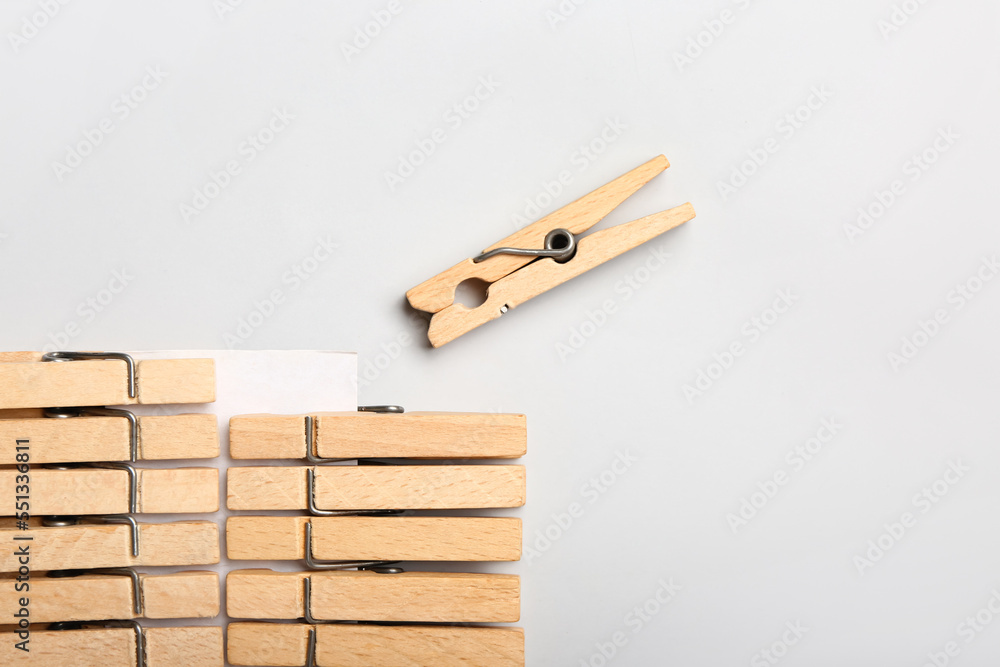 Wooden clothespins on white background, closeup