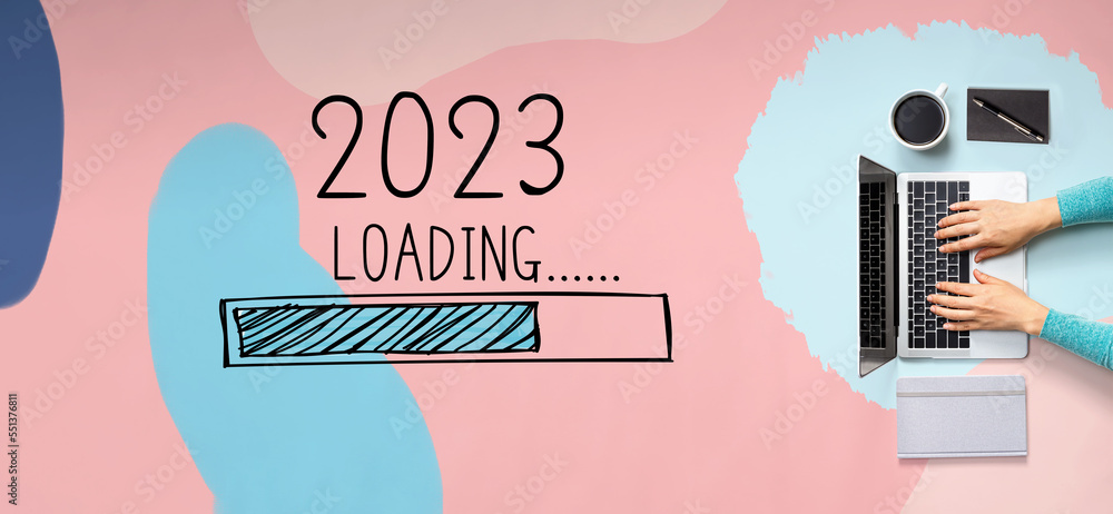 Loading new year 2023 with person using a laptop computer