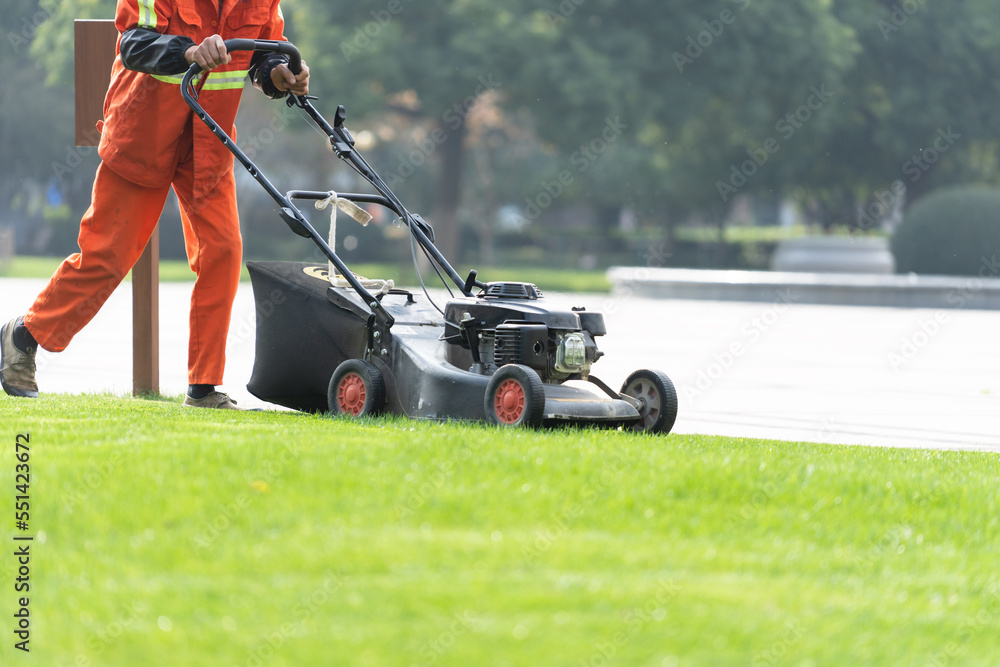 worker is mowing