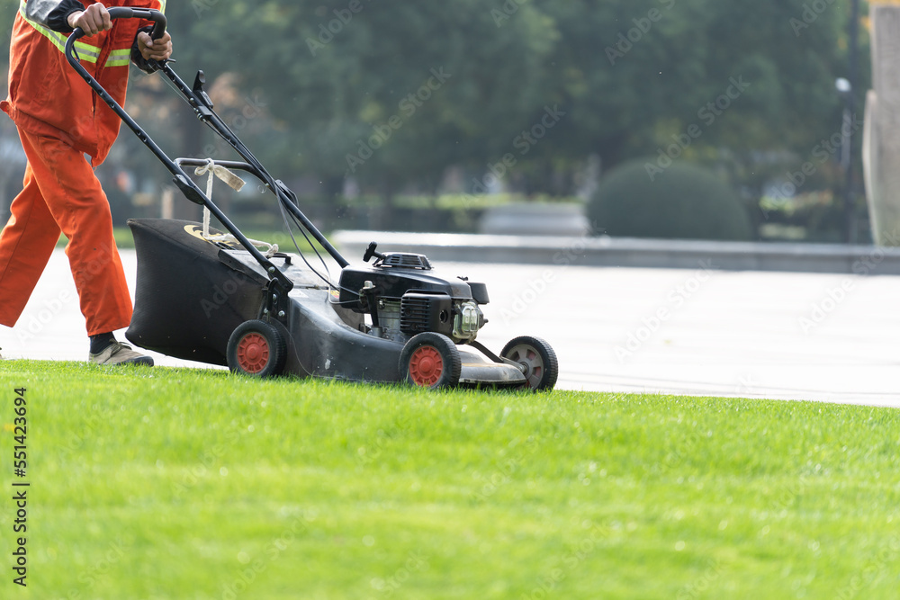 worker is mowing